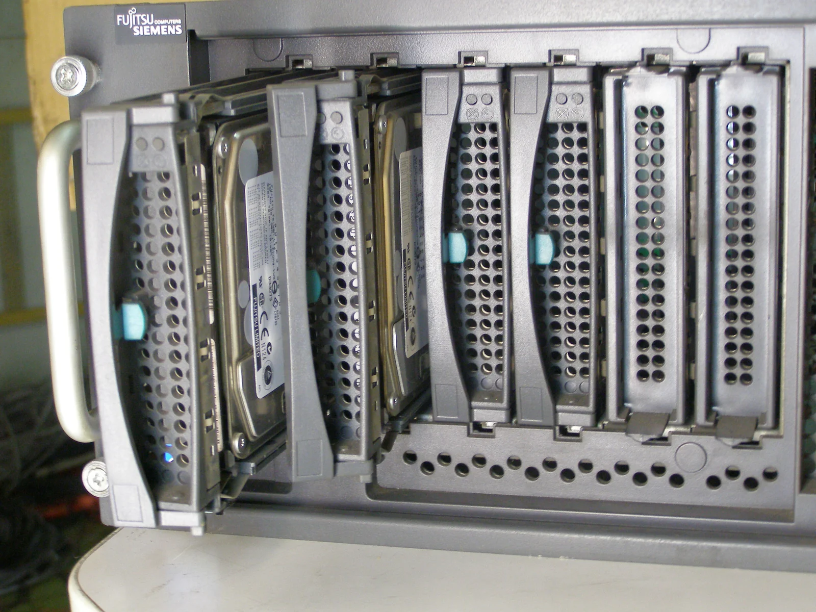 A real server drive bay illustrates that physical storage capacity remains separate from a logical folder quota